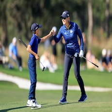 ORLANDO, FLORIDA - DECEMBER 18: Annika Sorenstam of Sweden fist pumps her son Will McGee as they walk down the 18th hole during the final round of the 2022 PNC Championship at The Ritz-Carlton Golf Club on December 18, 2022 in Orlando, Florida. (Photo by David Cannon/Getty Images)